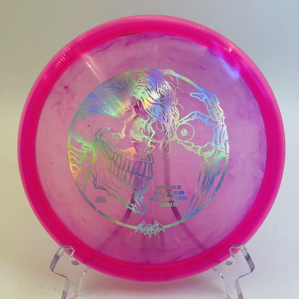 Top view of vivid red Discraft CryZtal Buzzz - 2019 Wingz Winter Revenge with unique foil design.