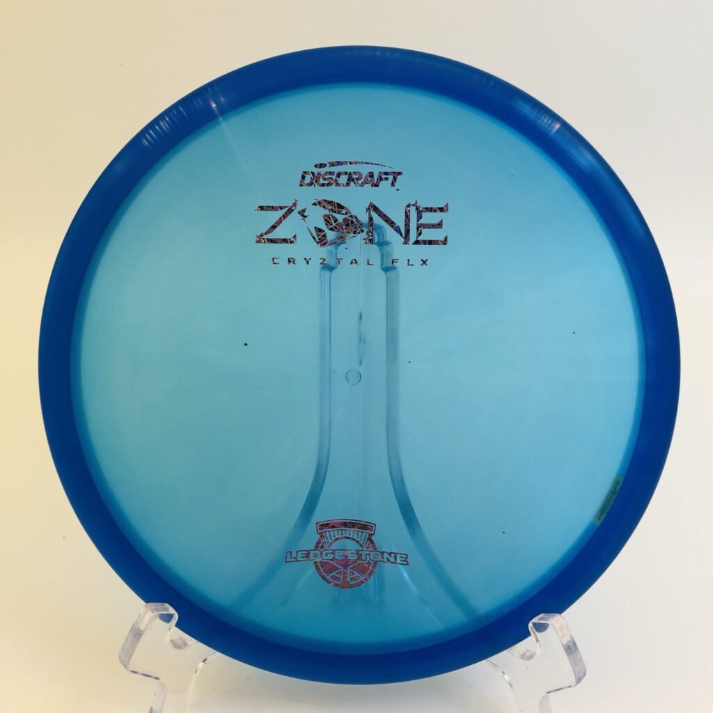 Top view of transparent blue Discraft CryZtal FLX Zone in 2022 Ledgestone Edition with silver foil stamp.