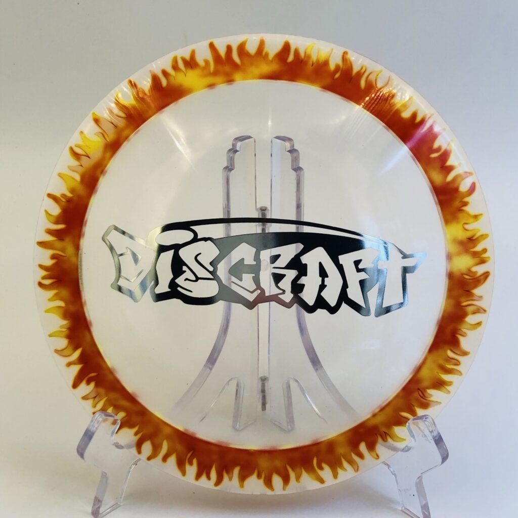 Discraft Scorch in Fly Dye plastic featuring a vibrant graffiti stamp design.