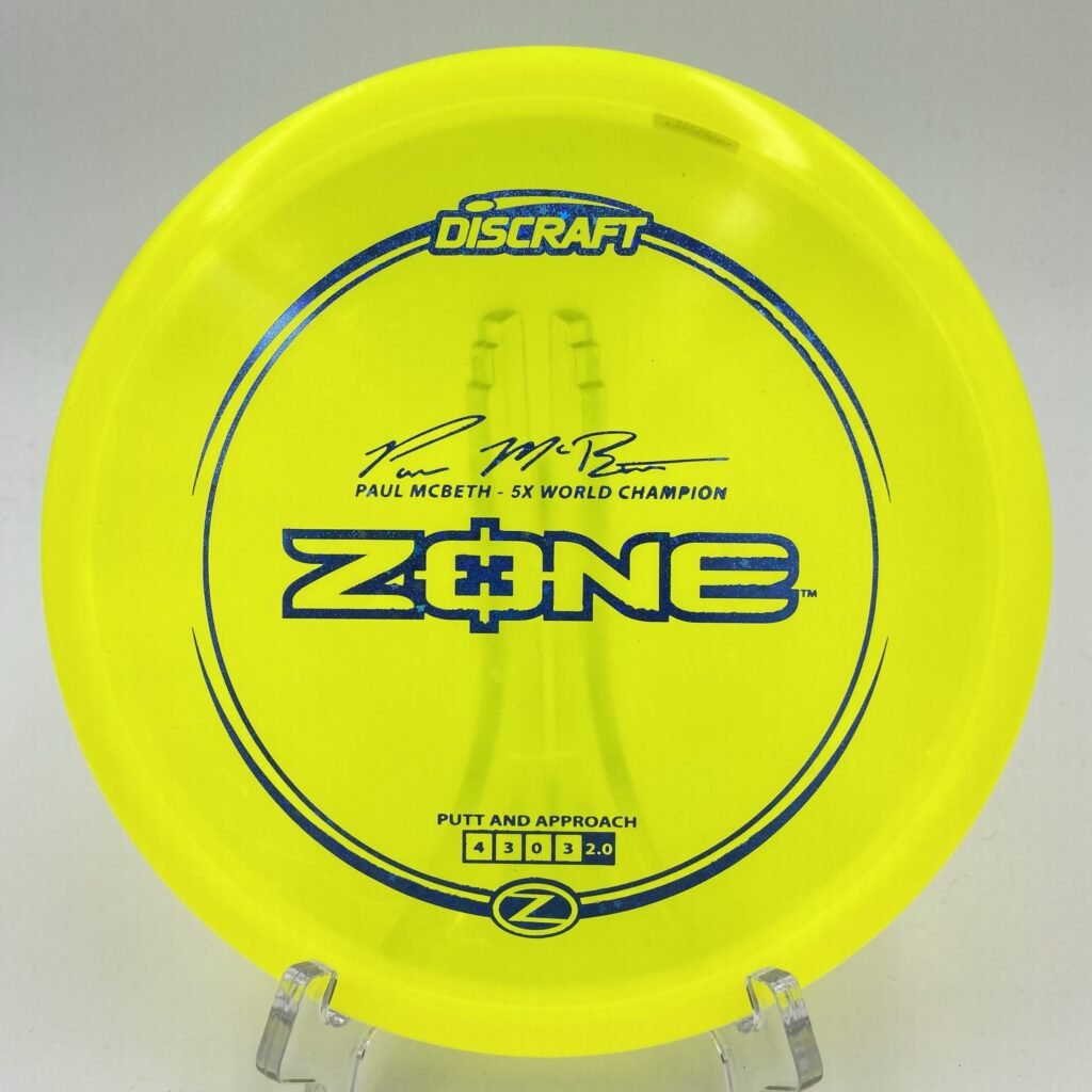 Top view of orange Discraft Zone in Z plastic Paul McBeth 5x edition.