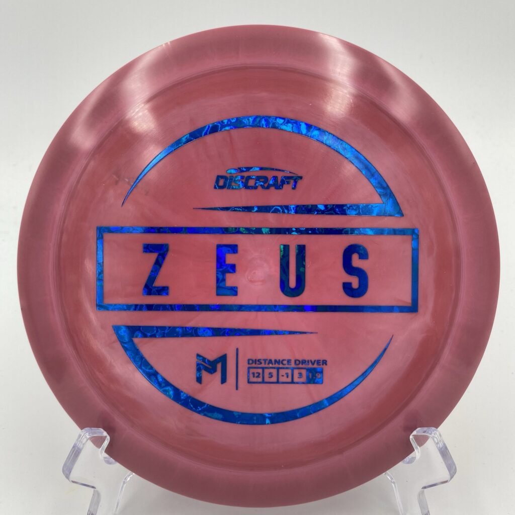 Main view of vibrant Discraft Zeus in ESP plastic showcasing 6x Paul McBeth signature.