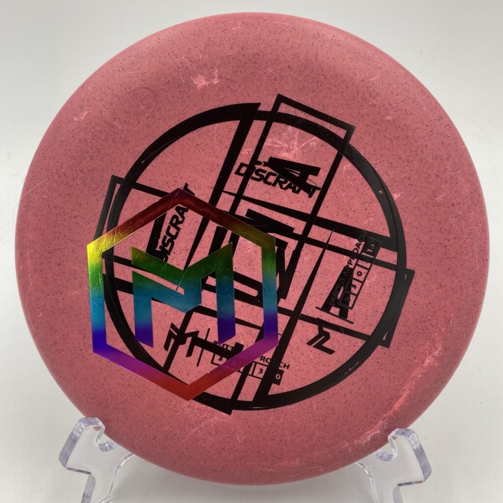 Top view of the misprint Discraft Luna in glow plastic featuring Paul McBeth's signature.